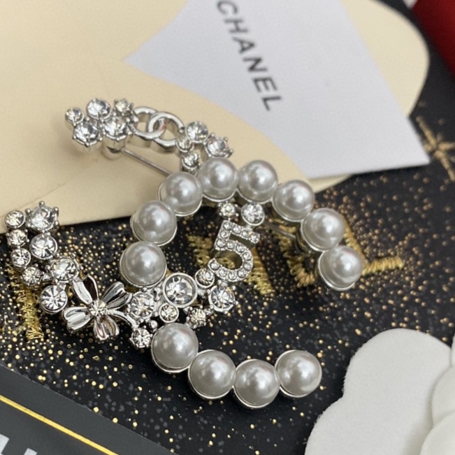 Ch*el brooches
